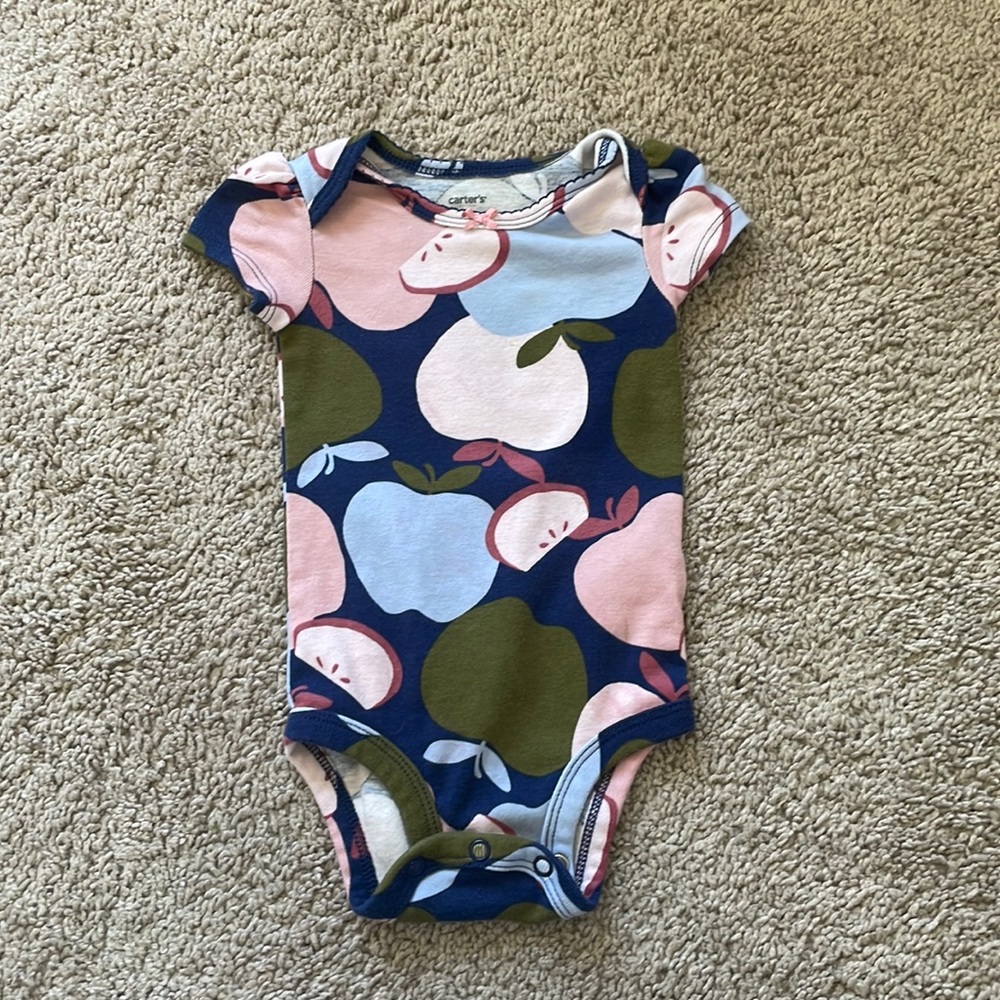 Baby girl 6 month onesies. There is one (tye dye onesie) that says 3-6 months.